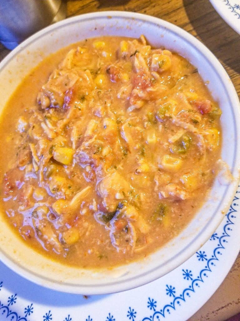 slow cooker chicken tortilla soup in a bowl.