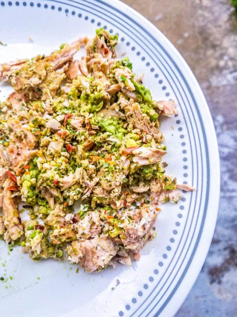 salmon avocado salad on a plate.