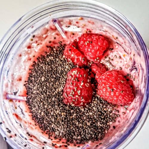 Strawberry Raspberry Smoothie in a cup with chia seeds