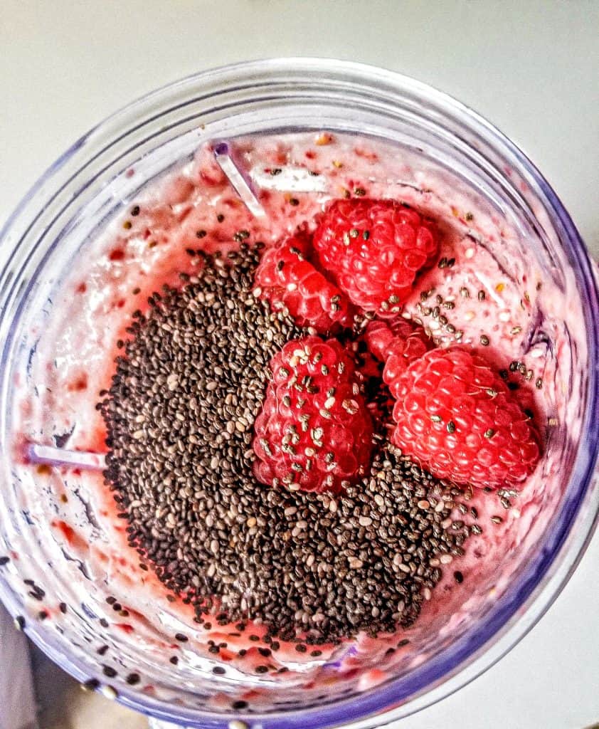 Strawberry Raspberry Smoothie in a cup with chia seeds.
