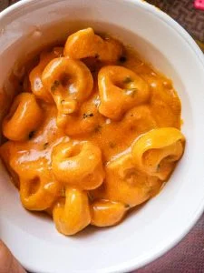 tomato soup with tortellini in a bowl