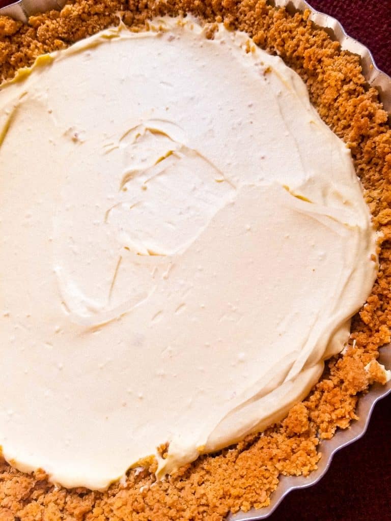 lemon cheesecake pie in a pie pan. 