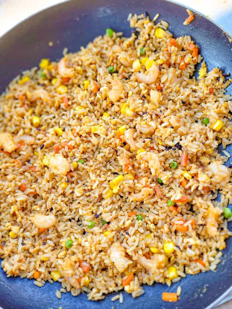 Shrimp Fried Rice in a black skillet. 