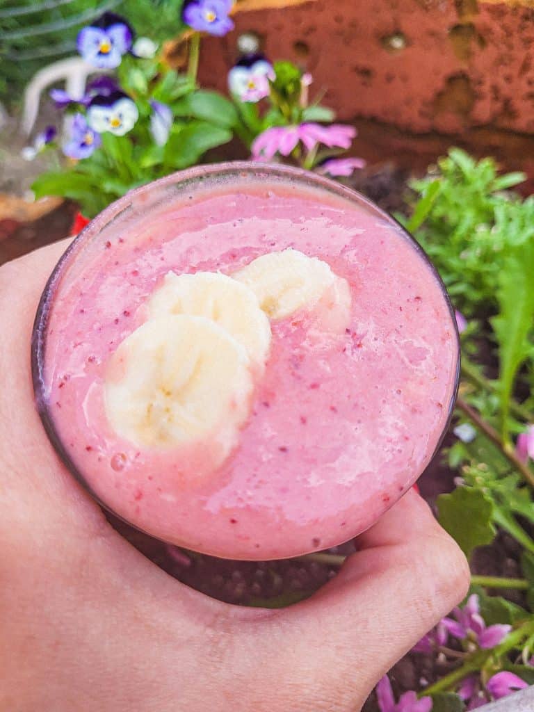 strawberry banana smoothie with banana slices on top. 