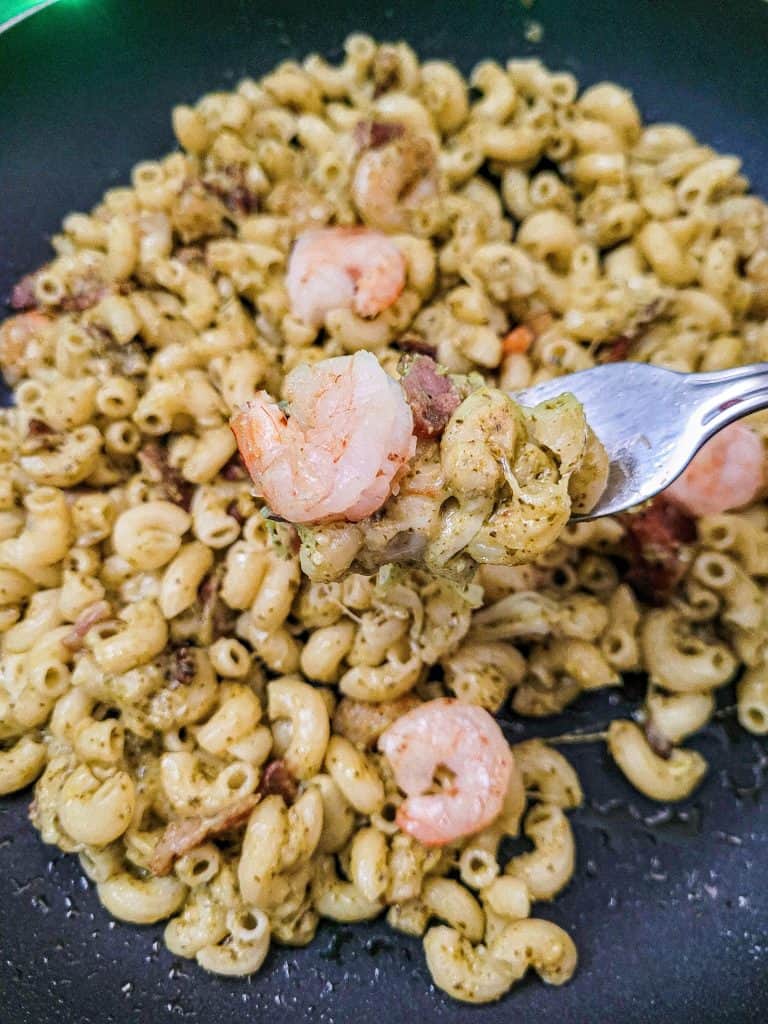 pesto bacon shrimp pasta with a fork. 