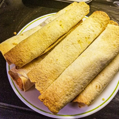 chicken flautas on a plate