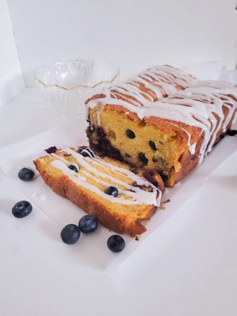 blueberry pound cake sliced open.