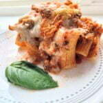 stuffed rigatoni with basil on a plate.