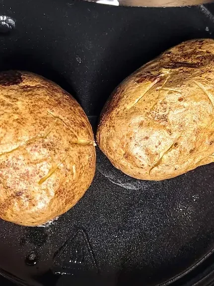 fully cooked baked potatoes in the air fryer.