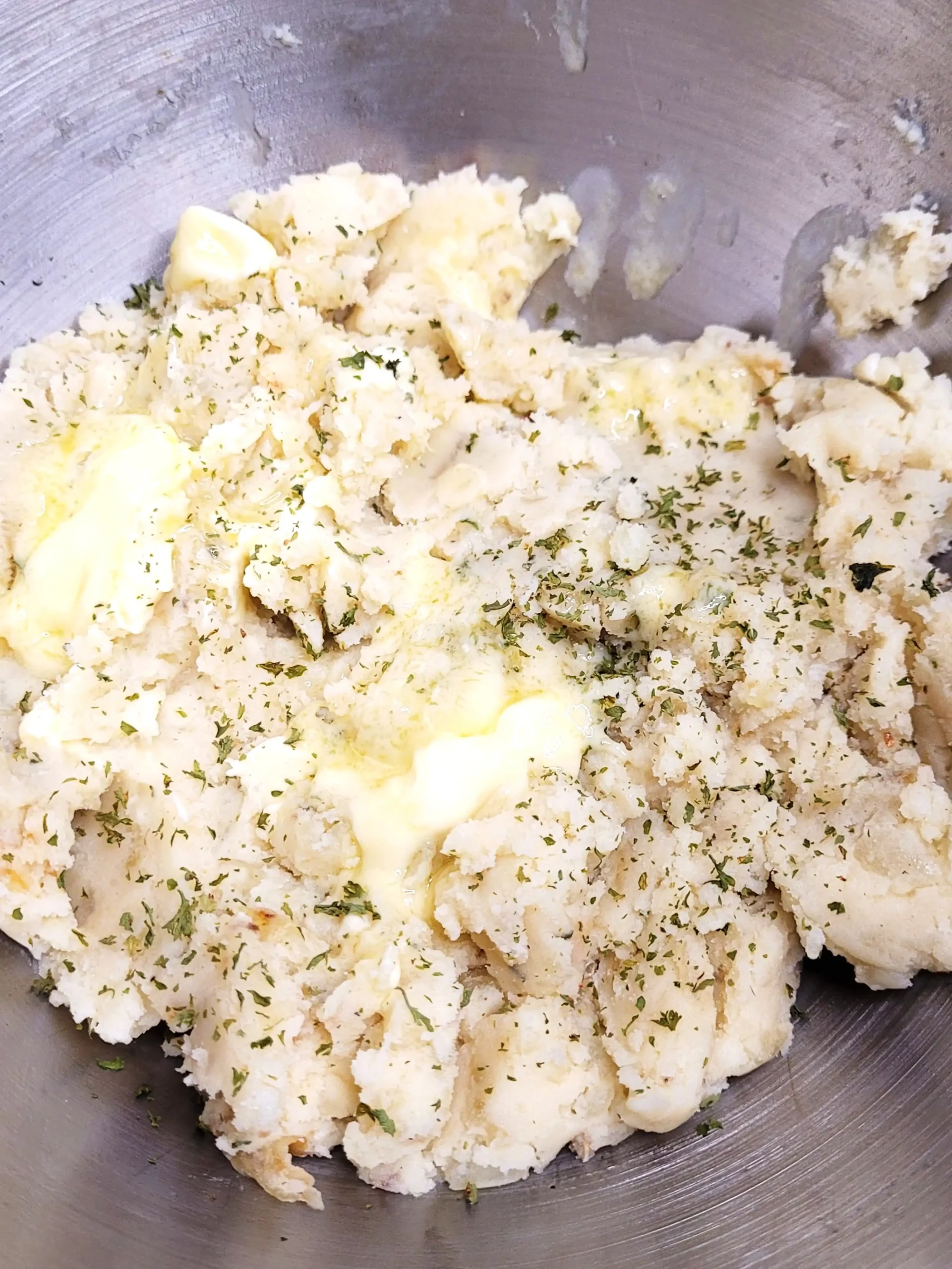 cream cheese mashed potatoes with butter on top.