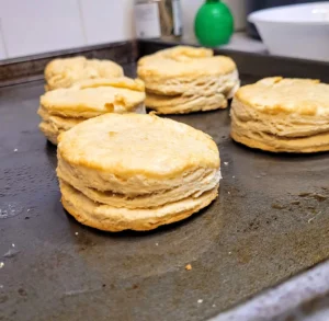 cooked biscuits on baking sheet close up.