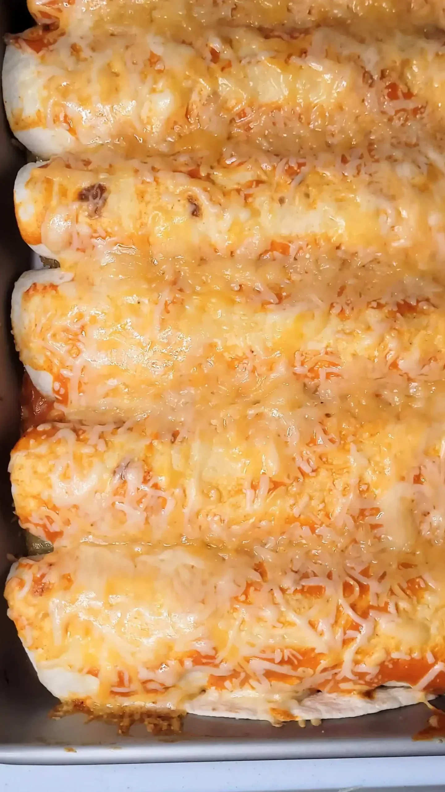 cooked buffalo chicken enchiladas in pan.