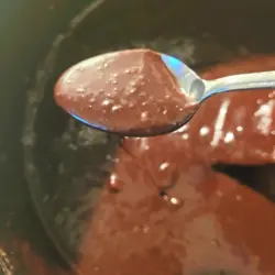 Hot fudge sauce on spoon.